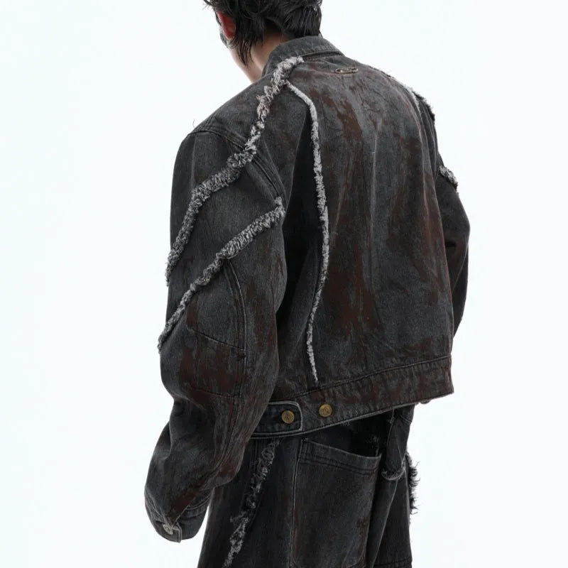 Black distressed denim coat and pants set with padded shoulders and gradient dye pattern