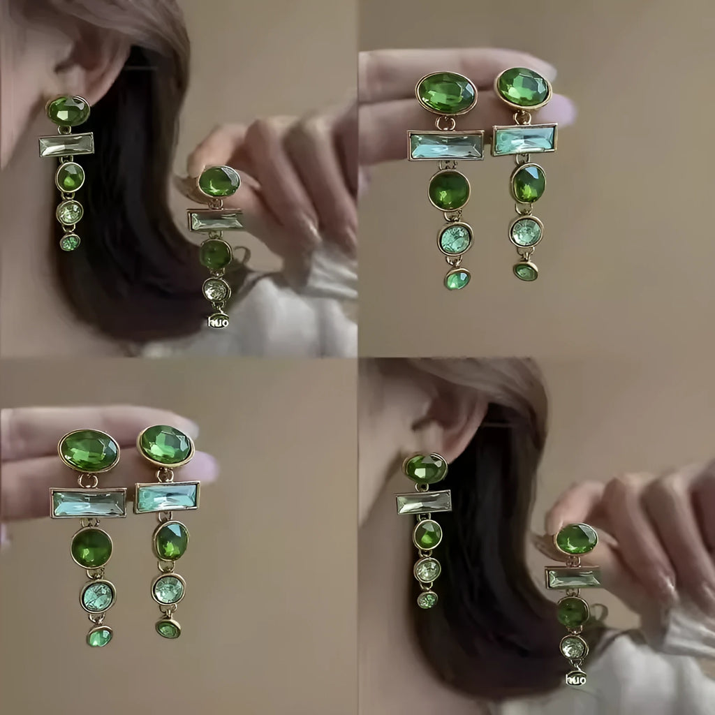 Green gradient tassel drop earrings with geometric alloy shapes and inlaid zircon stones on a white background.