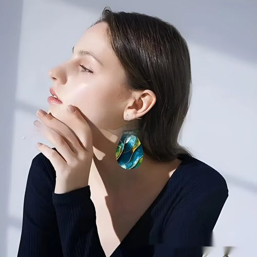 Printed acrylic drop earrings with flat branch knot geometric design on white background