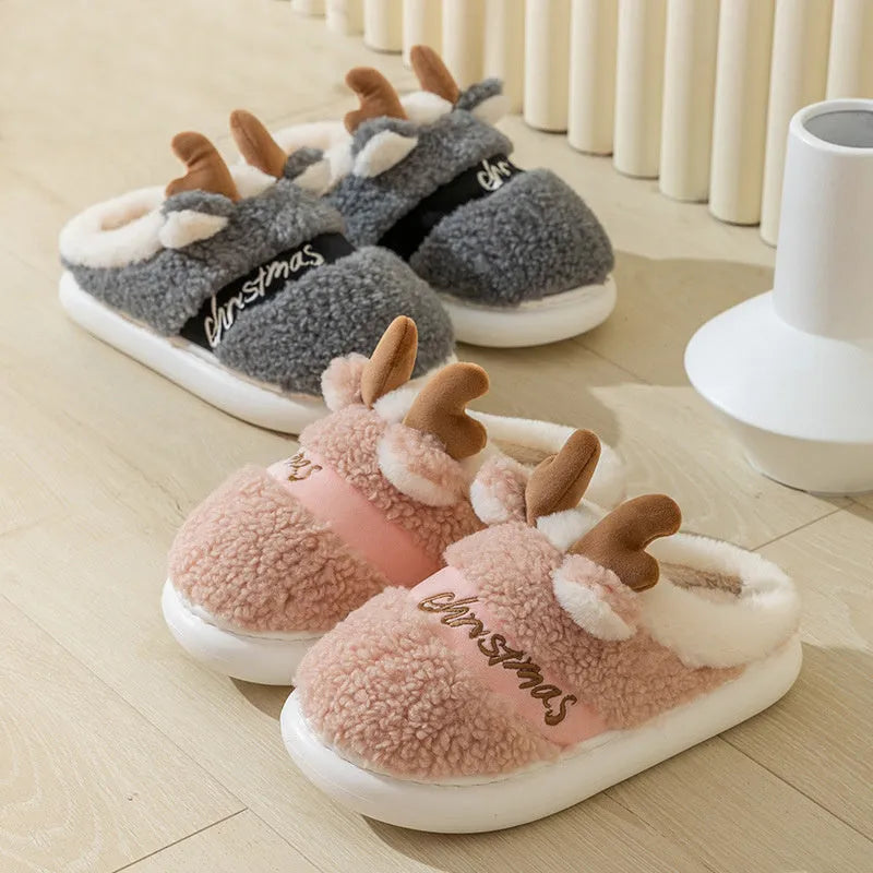 Christmas elk winter home slippers in pink with suede upper and thickened EVA sole on a cream background