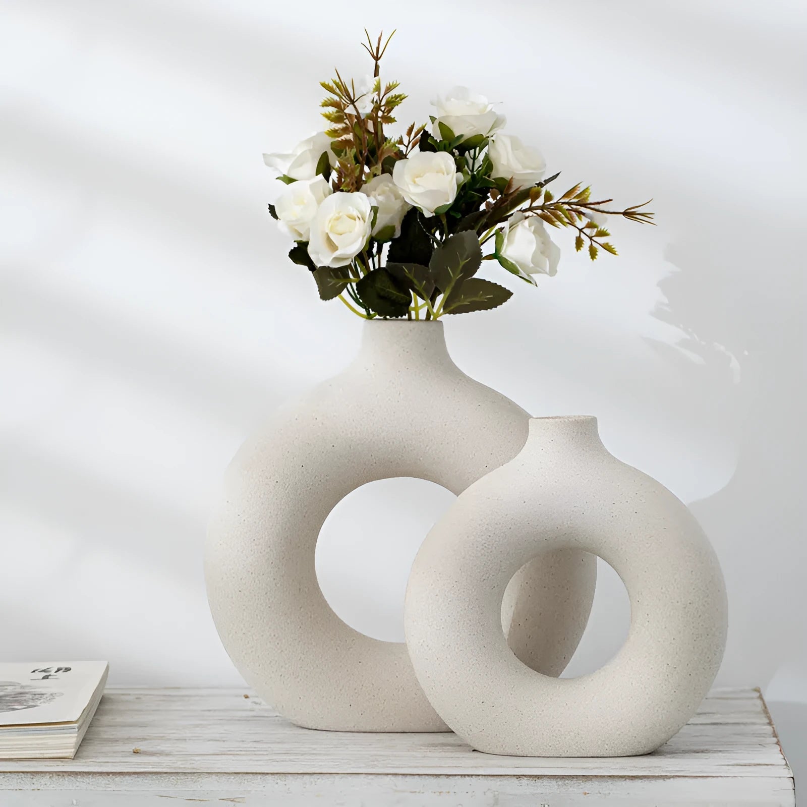 A simple modern frosted porcelain biscuit vase for flower arranging, shown in a neutral colour.
