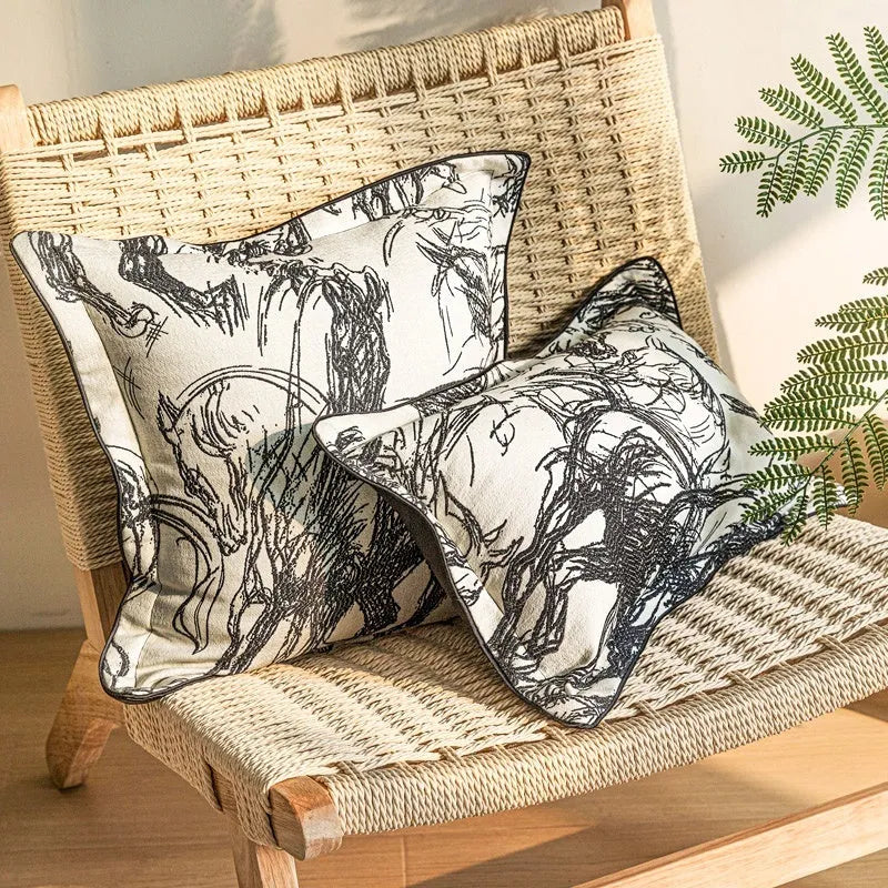 Abstract golden horse design decorative jacquard cushion on a grey sofa.