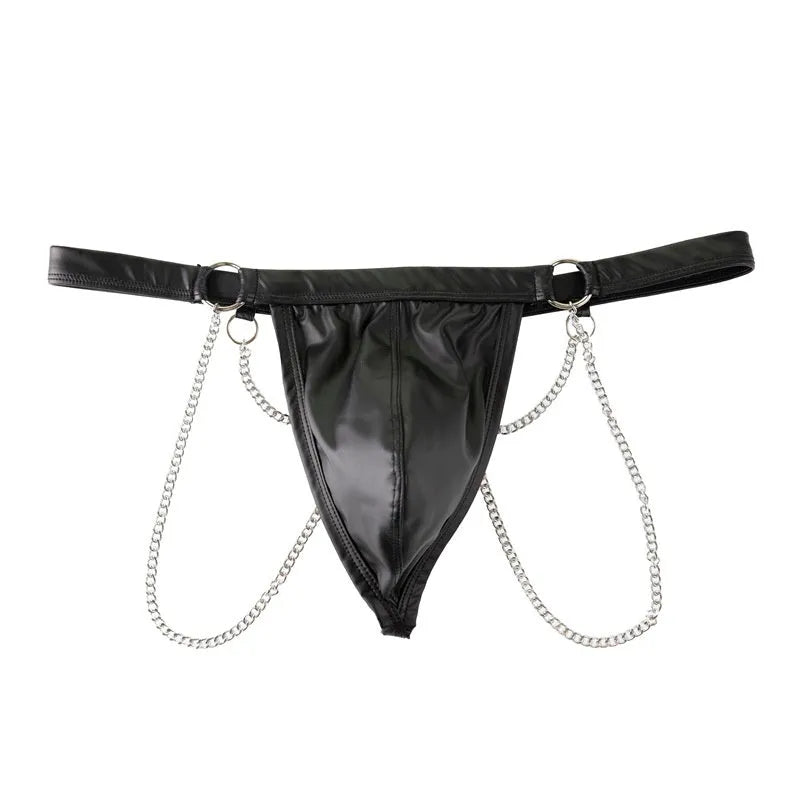 Men's black patent leather thong shorts with a metallic chain detail on the front.