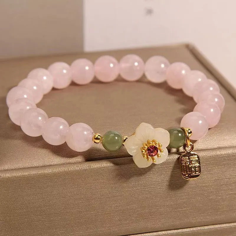 Crystal Hetian jade bracelet with peach blossom beads and camellia floral elements in pastoral national style design