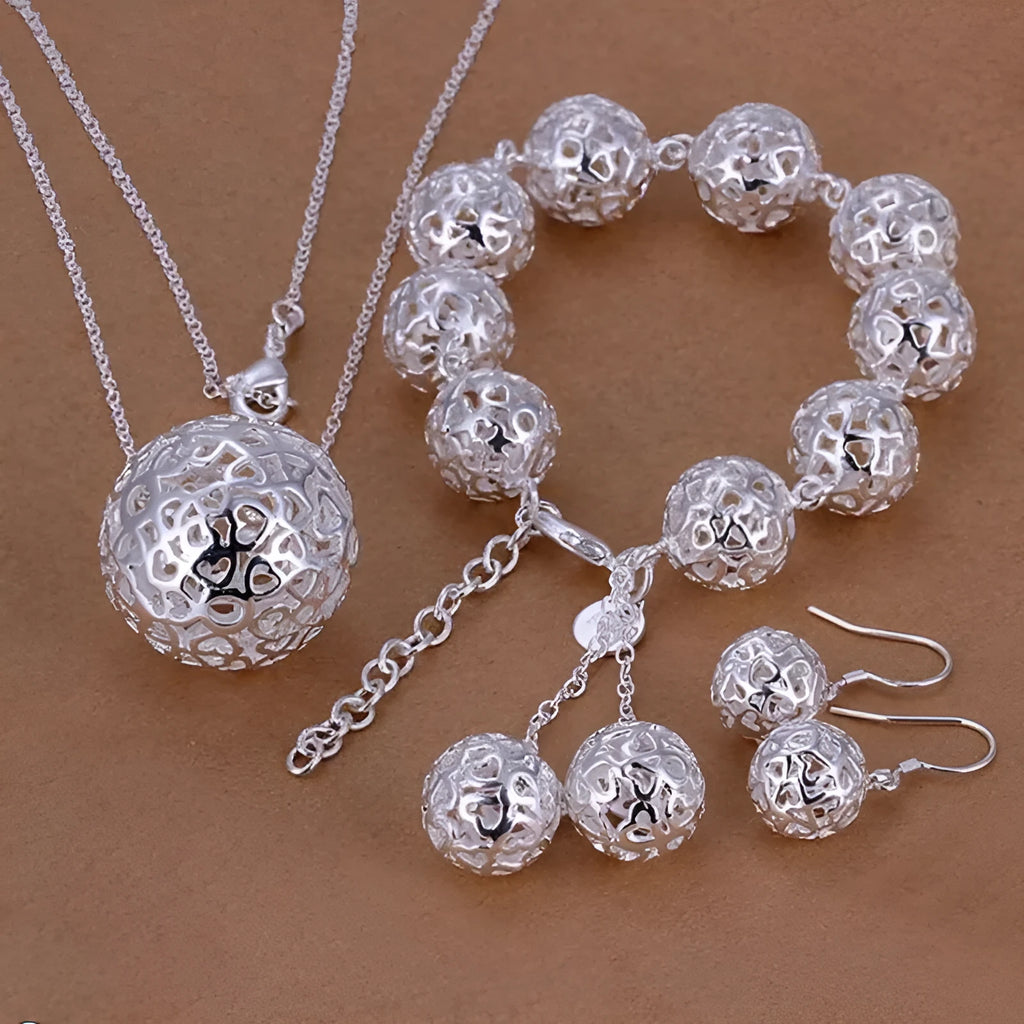 White silver-plated bracelet with three-dimensional geometric ball pendant on white background