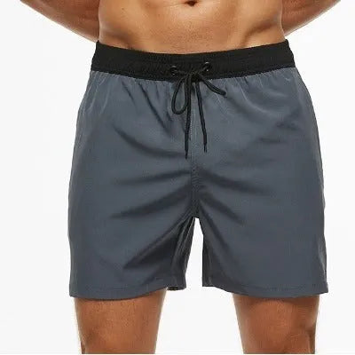 Men's blue stitching waist drawstring athletic shorts with a headband pocket and zipper fly.