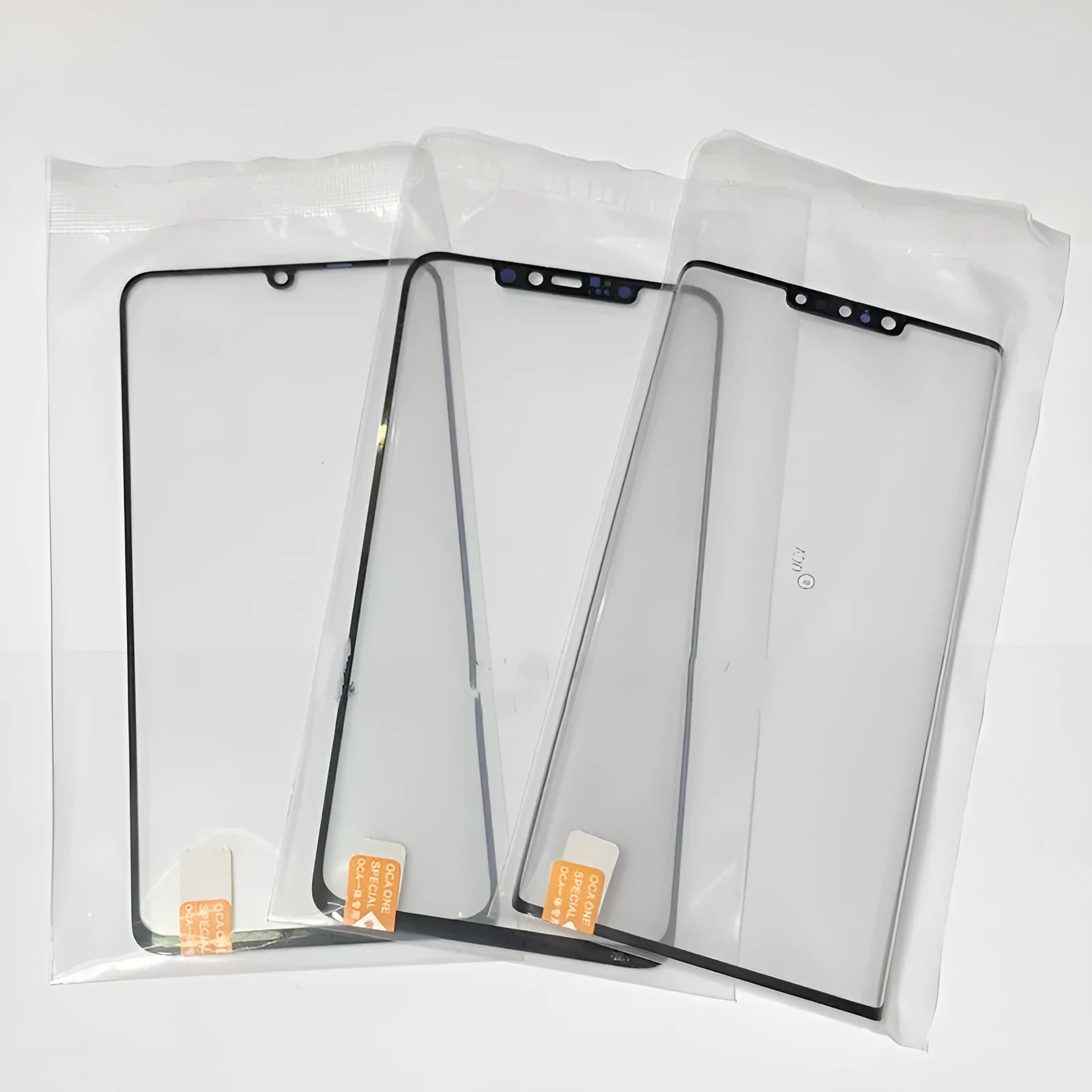 OnePlus 7 Pro replacement touch screen glass with OCA adhesive showing logo positioning markers