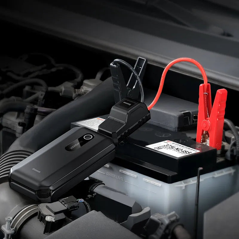 Black vehicle mounted emergency lighter jump starter with 10000mAh capacity and USB output