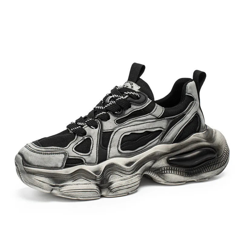Men's black and white low-top mesh sneakers with a platform sole and lace-up front.