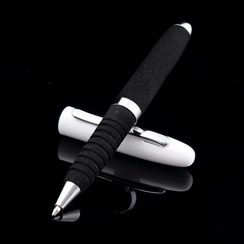 Silver EVA metal cap ballpoint pen with a 1.0mm tip on a notepad.
