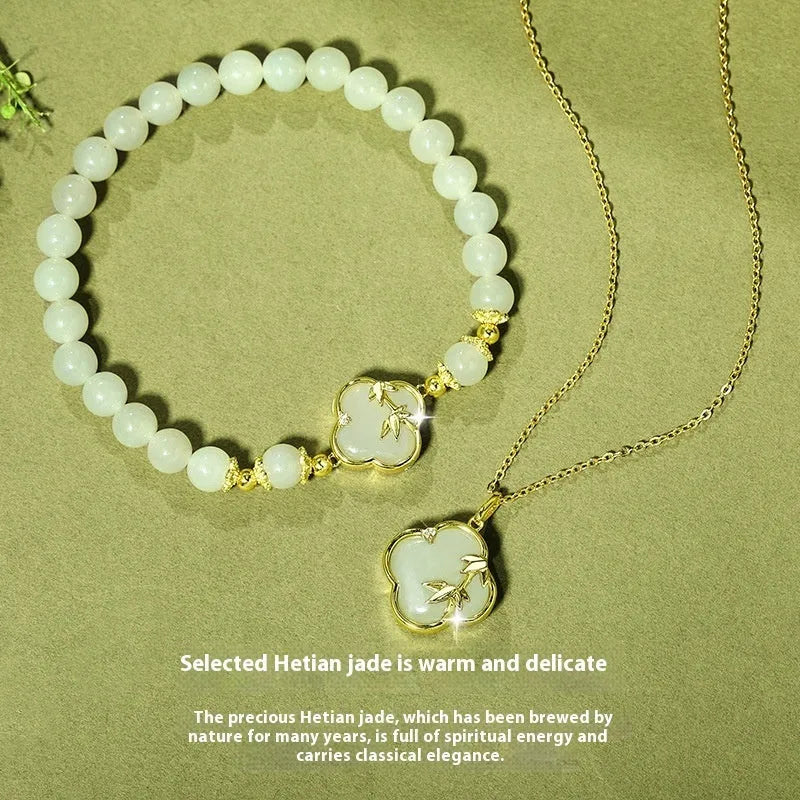 Hetian Jade festival bracelet and necklace set with inlaid jade leaf designs on bamboo newspaper tone background