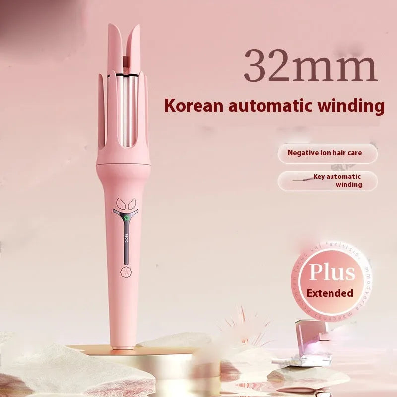 Pink automatic hair curler with 32mm barrel, three clips, and comb on white background