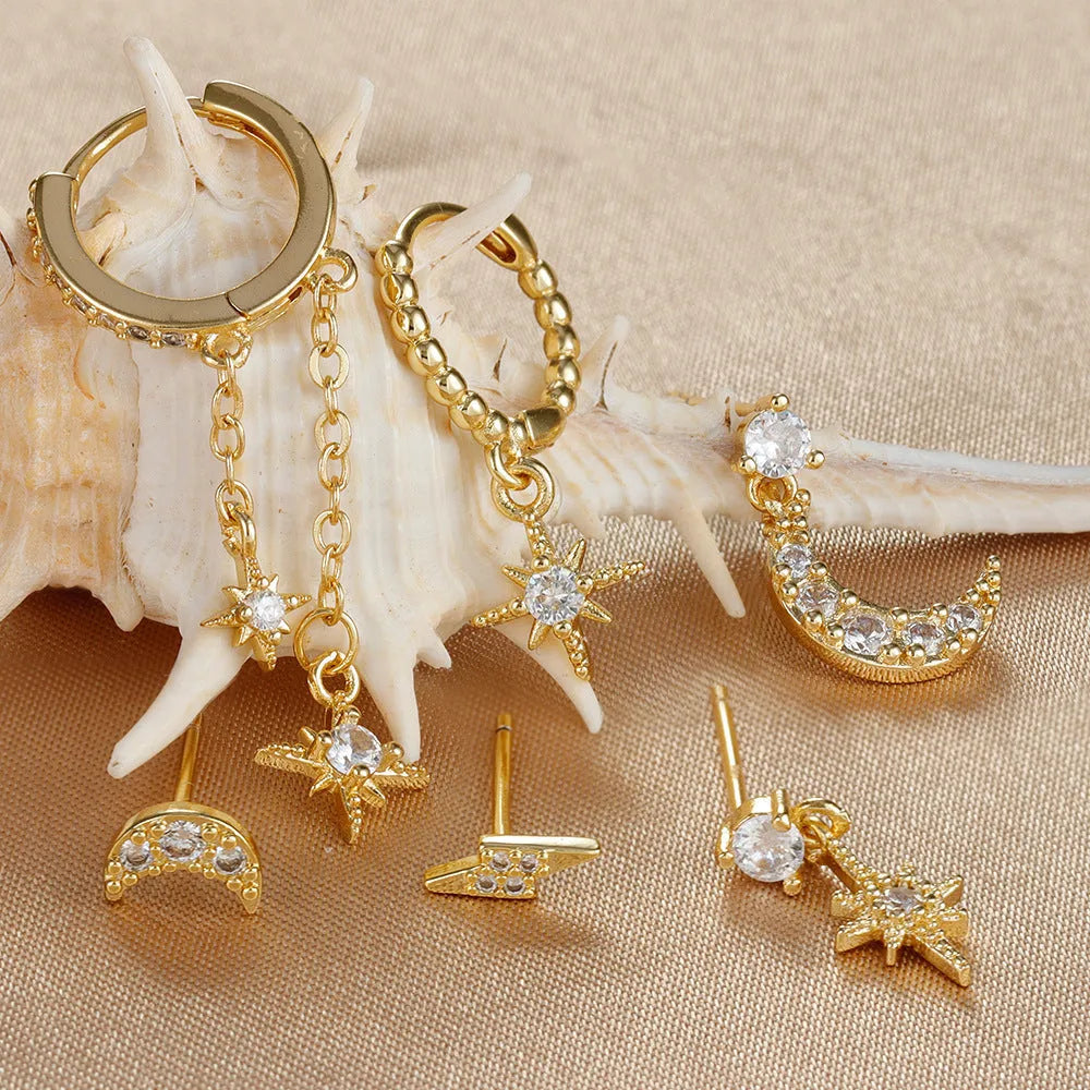 Six gold chain tassel earrings with zircon studs arranged as a complete jewellery set