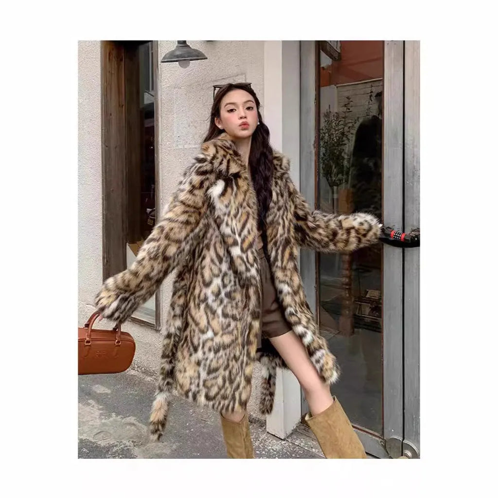 A model wearing a long faux fur coat with a fur collar and pockets.