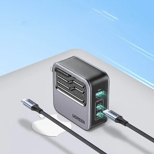 Compact 100W gallium nitride fast charger with Type-C port and included cable on a white background.