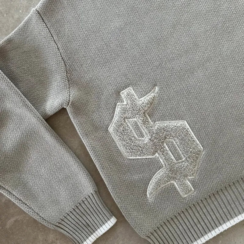 Grey loose-fit jacquard knit coat with long sleeves for autumn and winter.