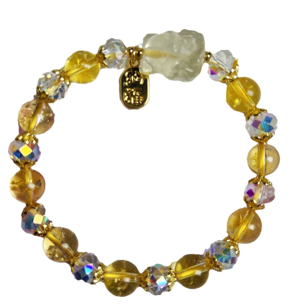 Handmade natural citrine crystal bracelet with detailed nine-tail fox design on a white background.