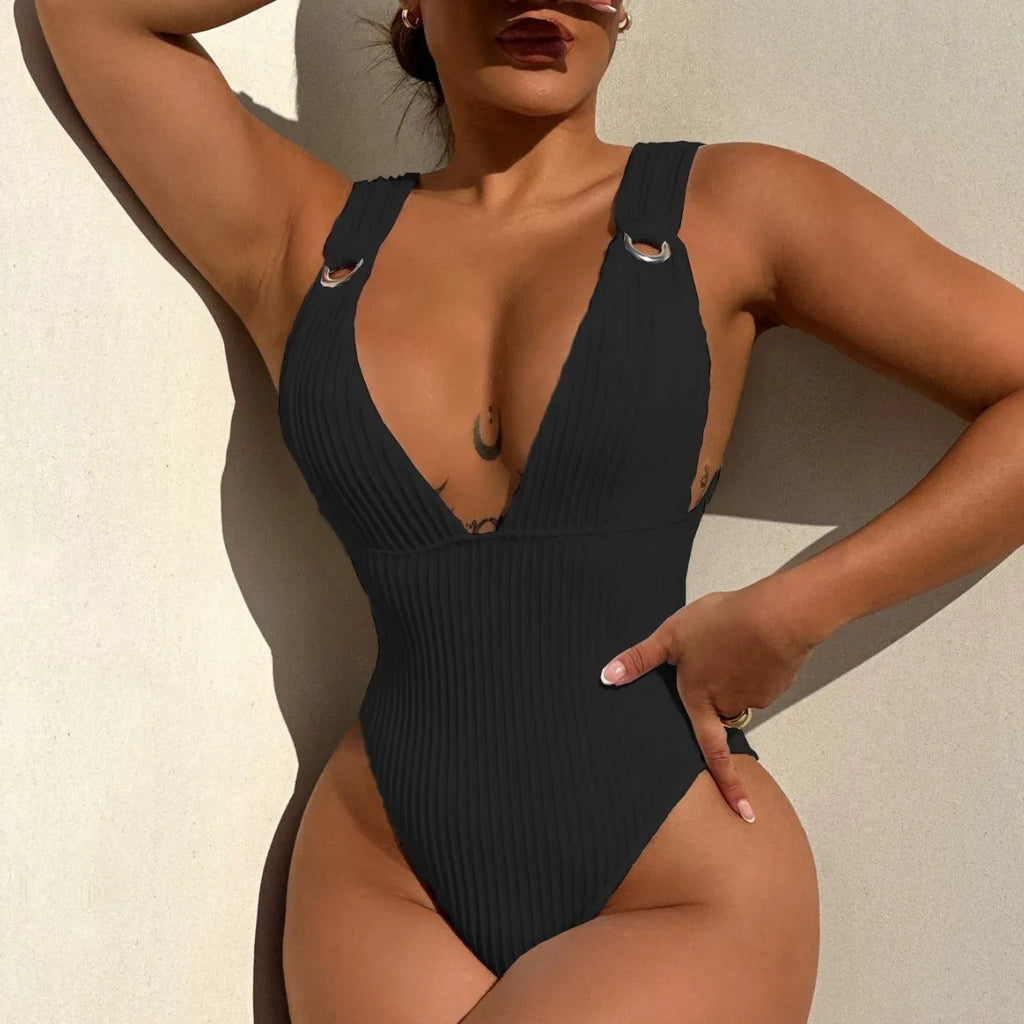 Women's solid colour one-piece swimsuit in spandex, shown in black, white, green, and orange.