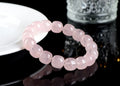 Pink unisex crystal bracelet with geometric barrel beads measuring 11-12 mm.