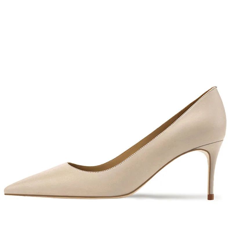 Women's black pointed-toe heeled pump with a soft sole and patent leather upper.