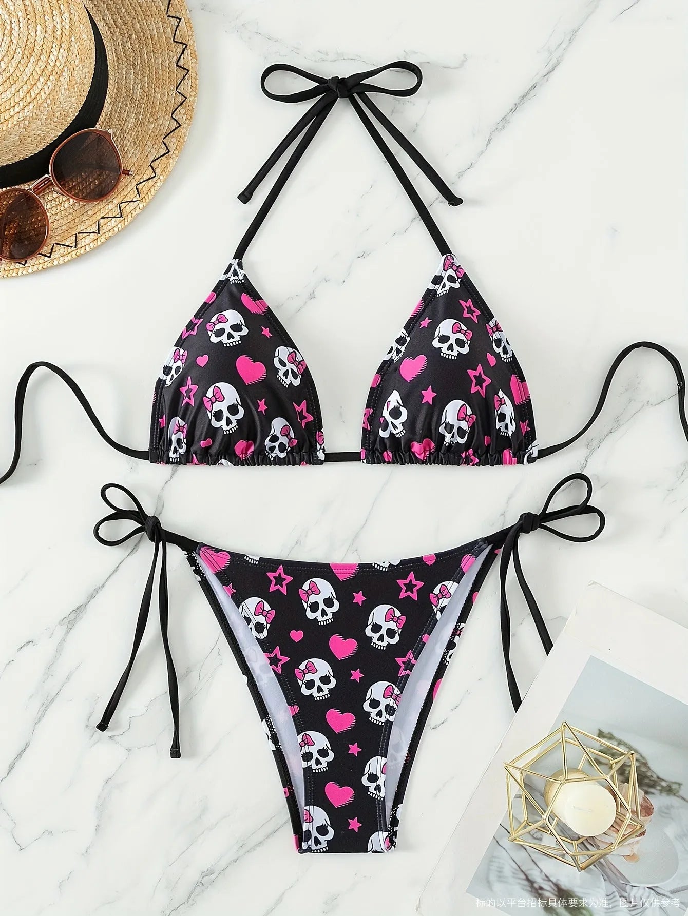 Women's black spider web print backless bikini top and shorts set.