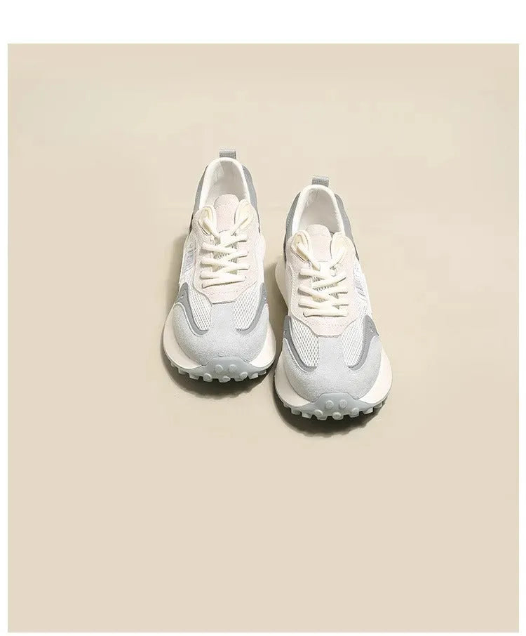 Women's grey and pink retro sneakers with low-top design and rubber soles