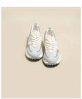 Women's grey and pink retro sneakers with low-top design and rubber soles