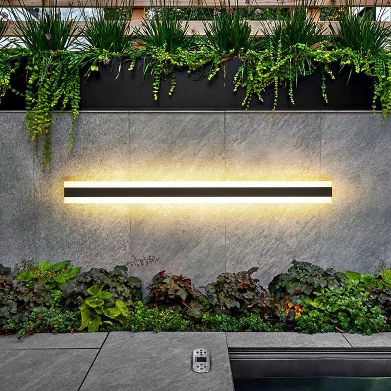 Outdoor waterproof LED wall lamp with linear design and IP65 rating on a wall.