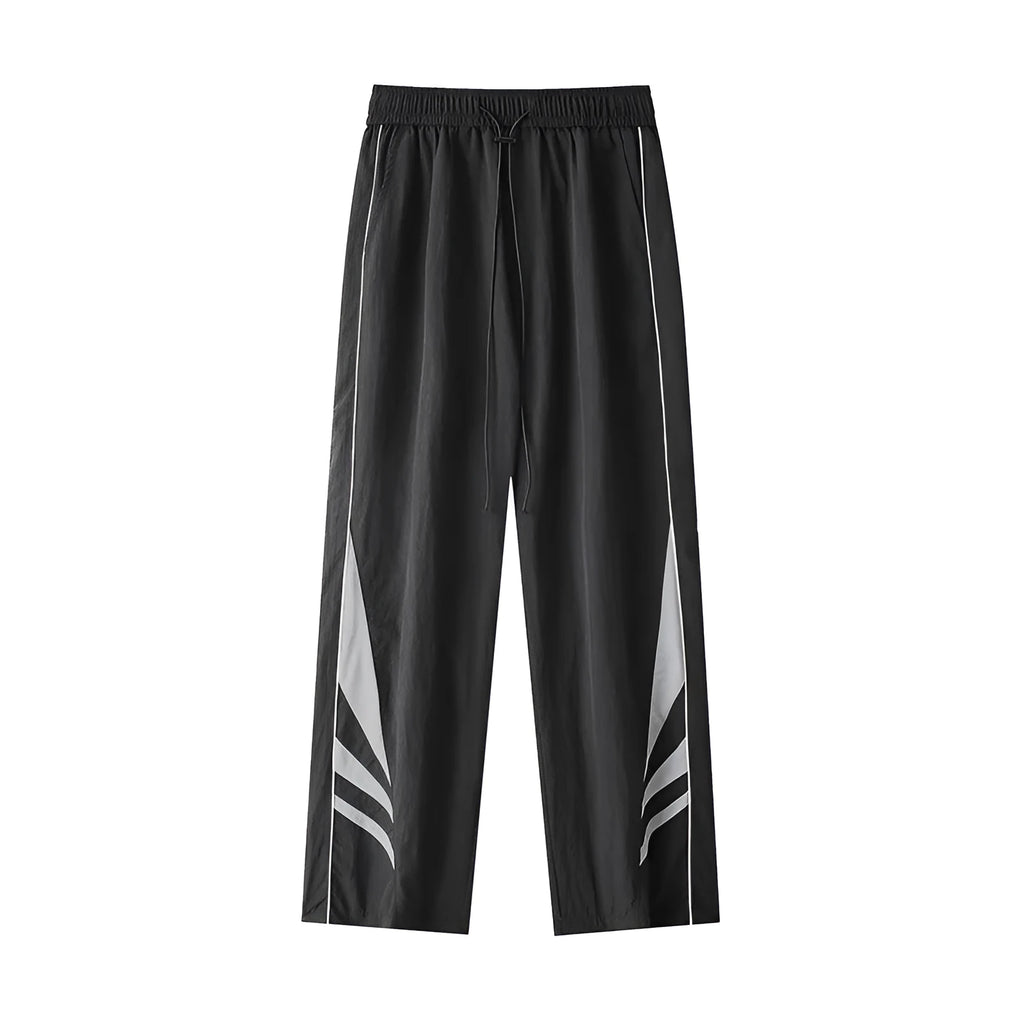 Men's straight leg trousers in black, showing button fly and elastic waistband on a hanger.