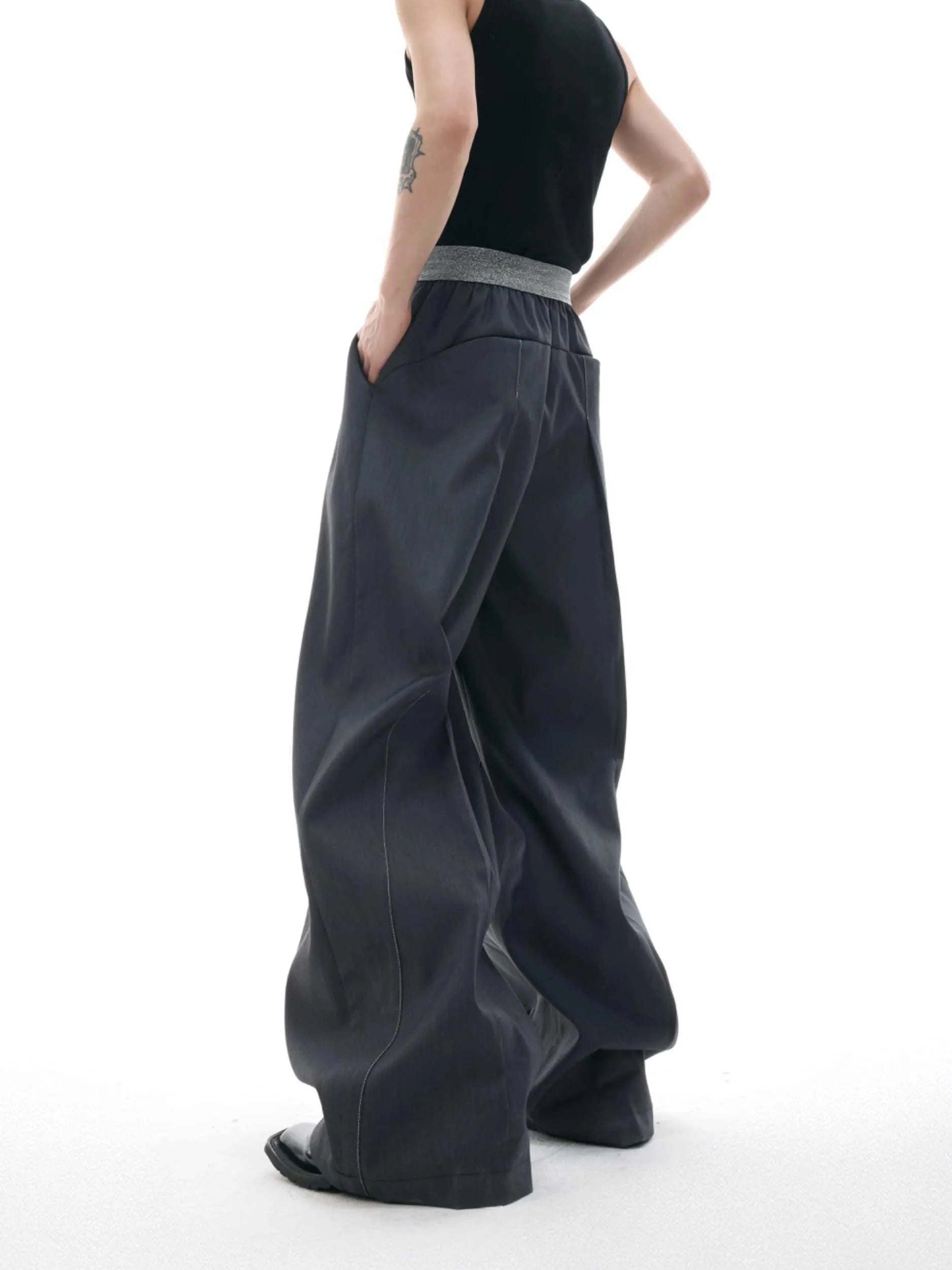 Straight-leg trousers with button-open seam design in black or grey polyester-cotton blend