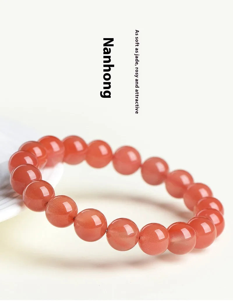 Natural cherry red agate beaded bracelet with high-polish stones on a wrist, showing single and three-strand style options.