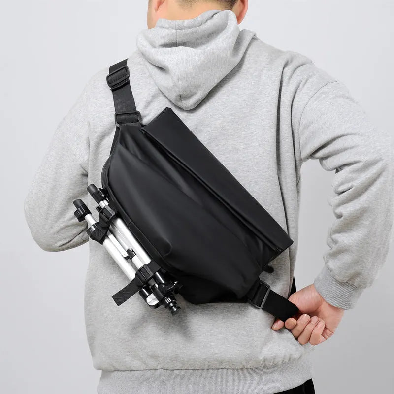 Grey men's medium PU leather crossbody sling bag with zipper and shoulder strap.