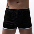 Men's cotton three-point boxer shorts in light blue, laid flat to show mid-waist design and trunk style.