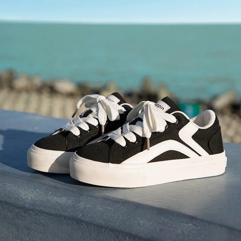 Women's low-top lace-up board shoes in blue, white black, black and white, and yellow black colour options