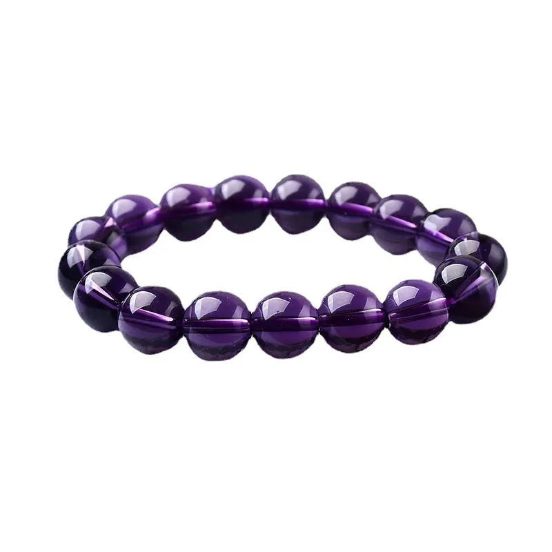 Geometric glass bead bracelet in obsidian, amethyst, citrine, or white crystal on a white background.