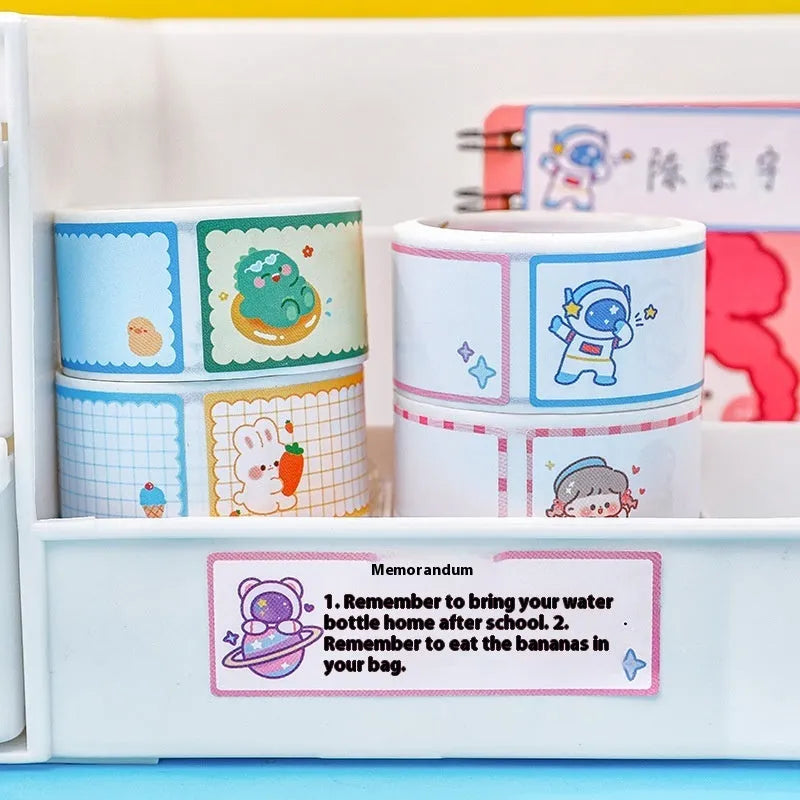 Roll of colourful cartoon name tape stickers showing dinosaur, astronaut, rabbit, and girl designs.