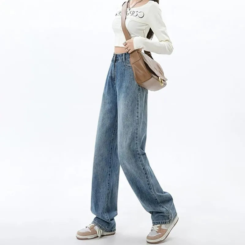 Woman wearing retro blue high-waist wide leg denim jeans with a relaxed fit.
