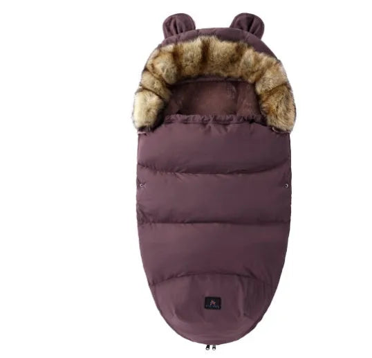 Baby warm cocoon style sleeping bag on a neutral background demonstrating solid colour design with zip closure