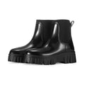 Women's creamy-white PVC low tube rain boots with flat heel and non-slip sole.