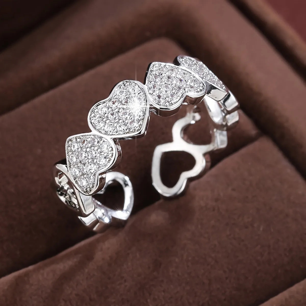 Adjustable geometric copper couple's ring with love heart design in gold or silver colour.