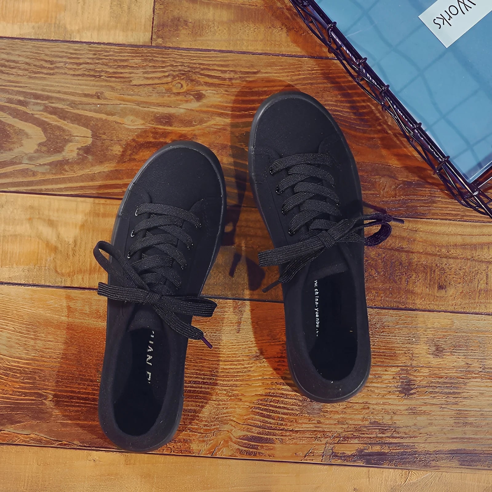 All black women's flat canvas lace-up shoes with a rubber sole