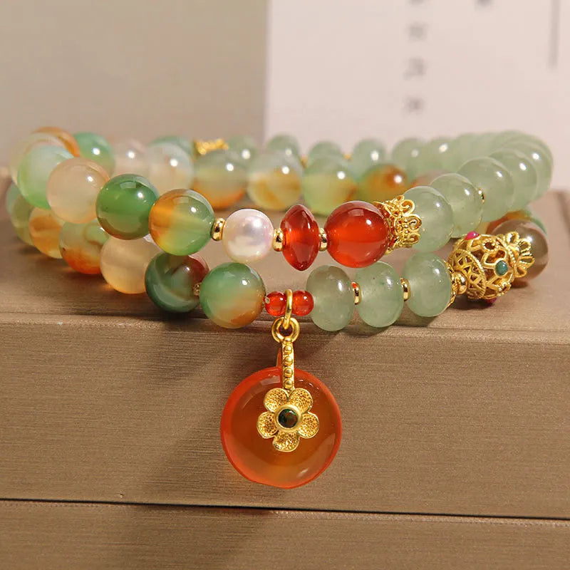 Women's peacock green agate double ring bracelet with alloy construction and safety buckle clasp.