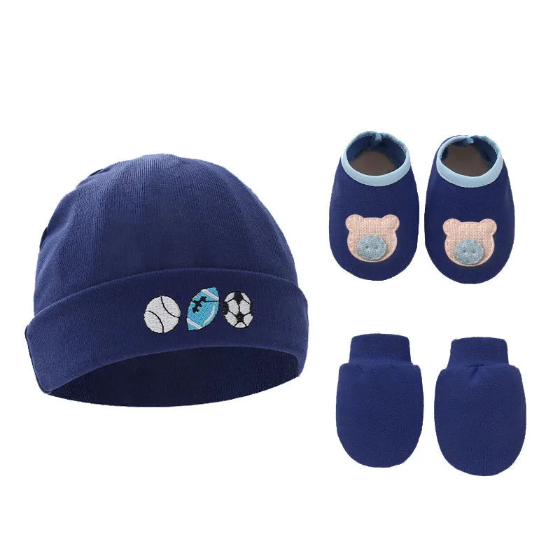 Set of white, light blue, and grey cotton baby pullover caps, gloves, and foot covers for infants.