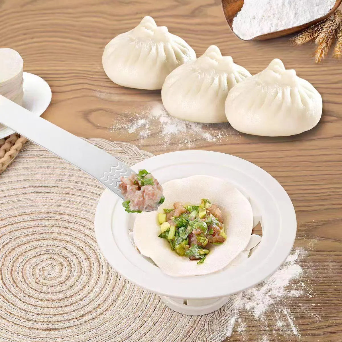 Set of four black plastic steamed bun moulds for making baozi, dumplings, and shaomai