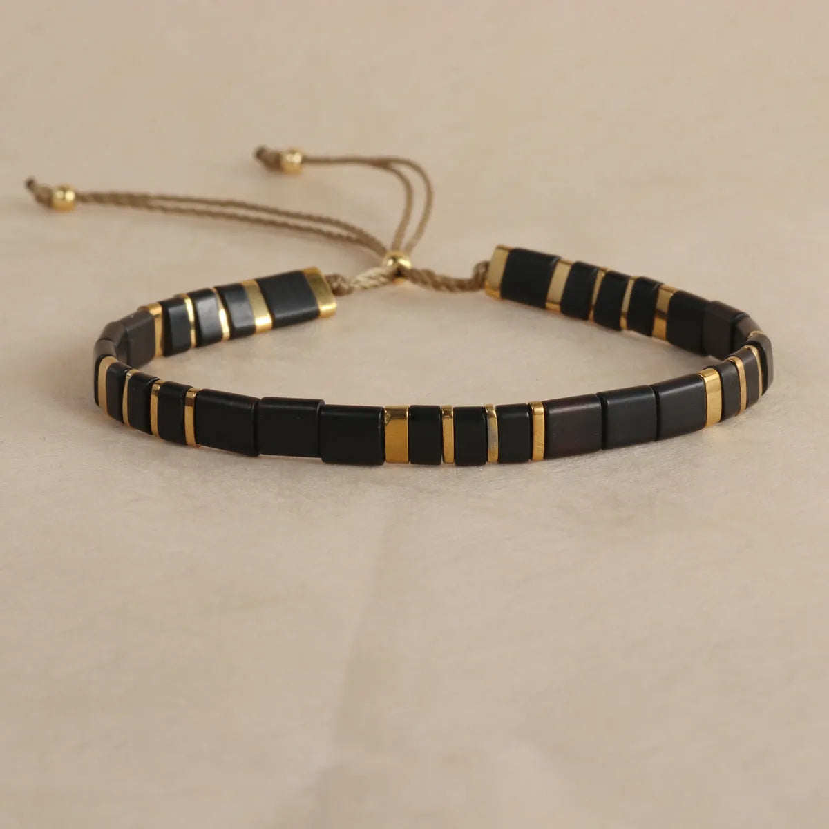 Geometric beaded bracelet with round glass and coloured glaze beads in five colour options.