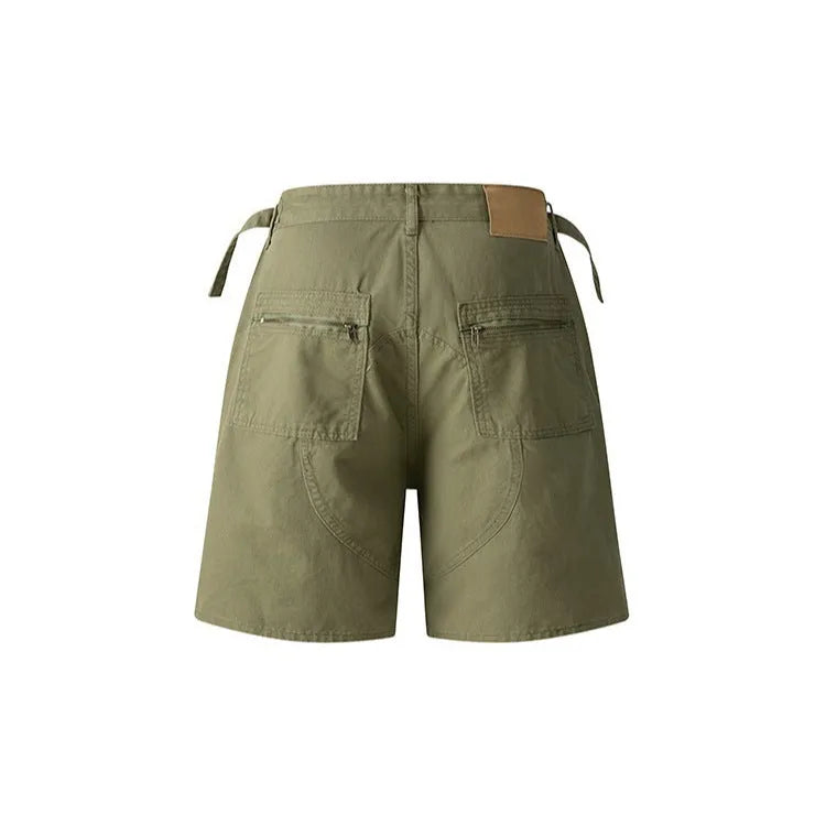 Retro loose-fit workwear shorts for men and women in washed cotton with a zipper fly, shown in grey colour.