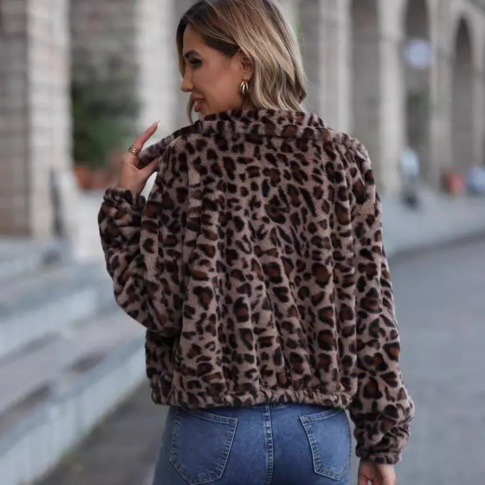 Women's loose long sleeve leopard print plush coat with full zip on a hanger
