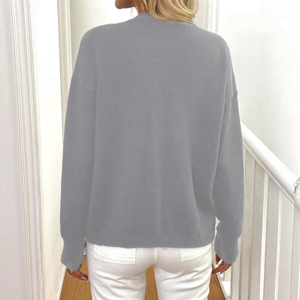 A grey women's deer plush sweater coat with long princess sleeves and an irregular hem.