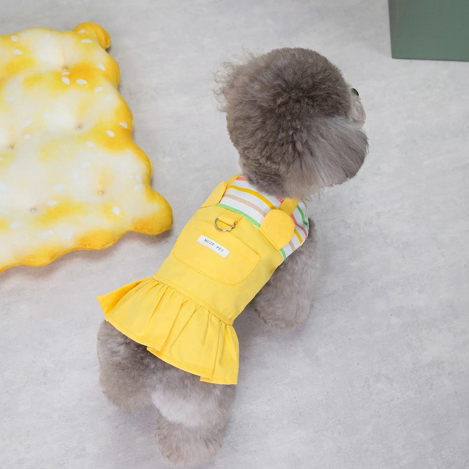 Orange red and yellow striped patchwork cotton skirt for dogs, shown in casual style.