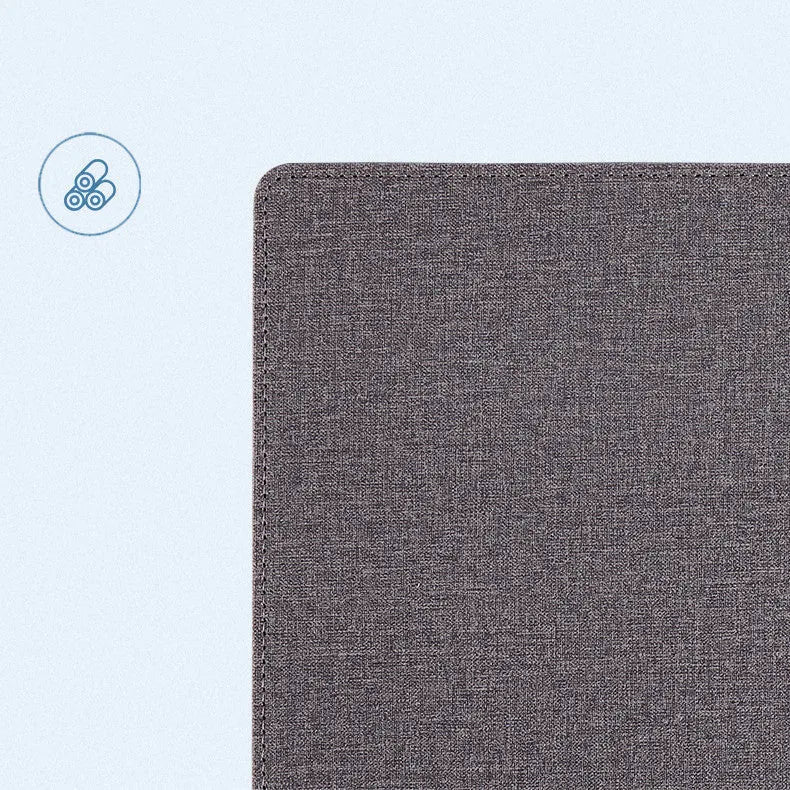 Pink PU leather mouse pad with wireless charging spot and an upright phone in the holder